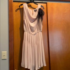 Dress  attached black chiffon ribbon. Pleated